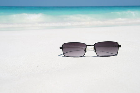 sunglasses on beachの写真素材