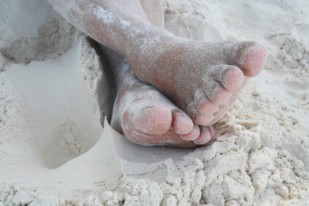 barefoot on sand beach