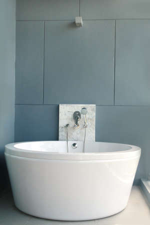 White bath on a gray background, bathtubの写真素材