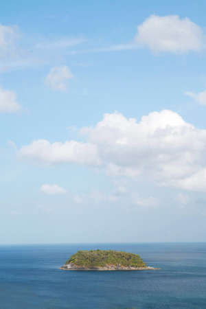 small island in blue seaの写真素材