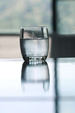 cold drinking water glass on tableの写真素材