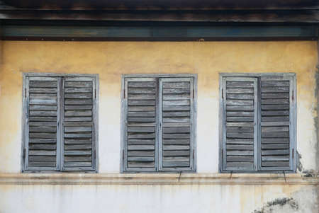 vintage window on wallの写真素材