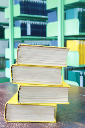 yellow book stack on table 