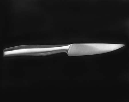 metal knife on blackの写真素材