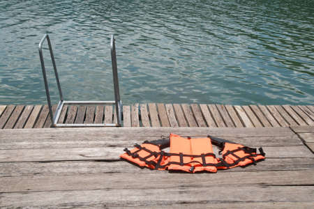 life jacket on floor ,swimmingpool の写真素材