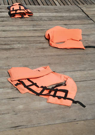 life vest on wood floor の写真素材