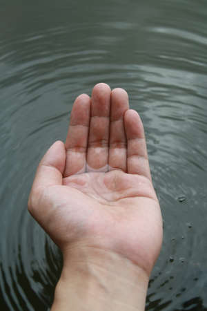 water stream on hand の写真素材