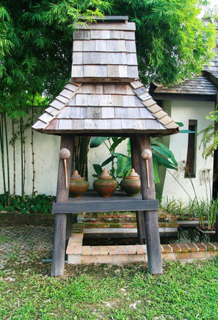 clay water pot at house gate for welcome guest, Chiang Mai traditional, Thailand の写真素材