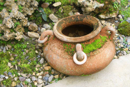 Old earthenware in garden の写真素材
