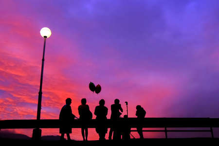people shadow with sunset sky の写真素材