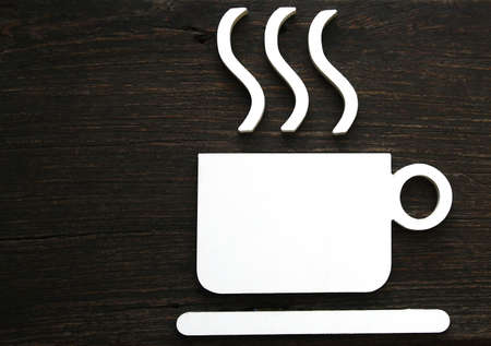 Hot coffee cup sign, wood wall の写真素材