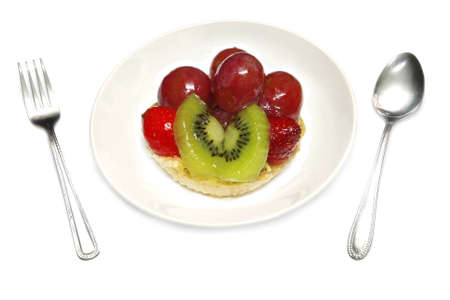 fruit tart in white plate の写真素材