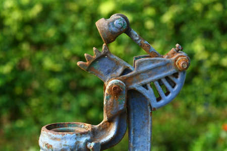 close up macro rusty chain and green gearの写真素材