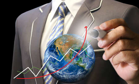 business man's hand writing earthの写真素材