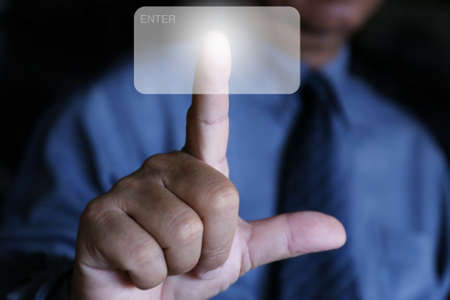 businessman use finger click the airの写真素材