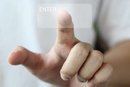 finger push "enter" button backgroundの写真素材