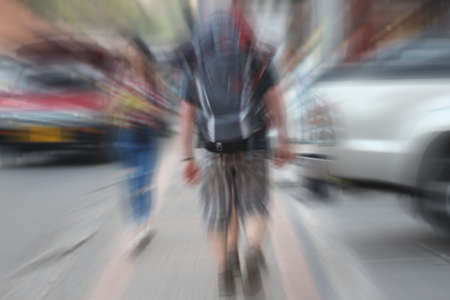 blurred people walk on road, backpackerの写真素材