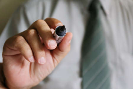 businessman hand writing penの写真素材