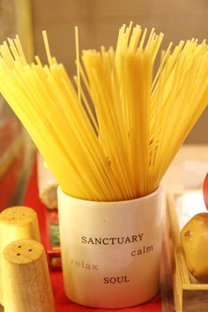 dry spaghetti in mugの写真素材