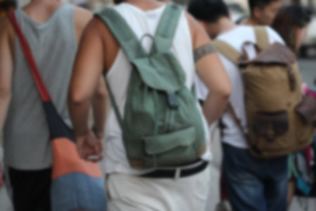 blurred people walk on road, backpacker