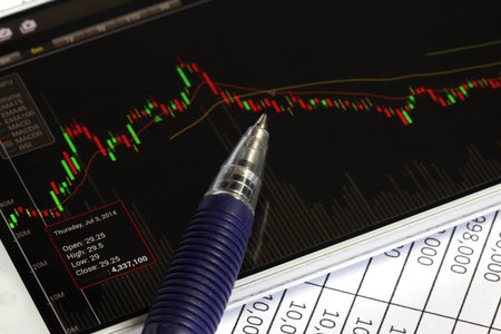 smartphone and stock chart investment trading background