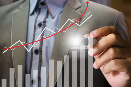 business man's hand writing graph chart, backgroundの写真素材