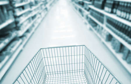 blurred supermarket cart backgroundの写真素材