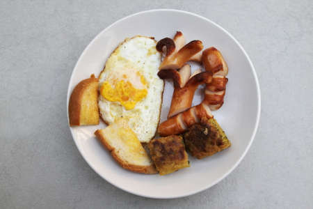 breakfast, bread ,fried eggs ,sausage, cafeの写真素材