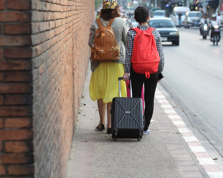 blurred people walk on road , background