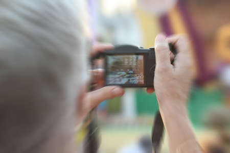 blurred people take photo, outdoor parkの写真素材