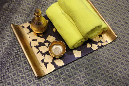 Spa and wellness setting with natural soap, candles and towelの写真素材