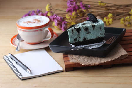notebook pen and coffee cup with cake and cookie, cafeの写真素材