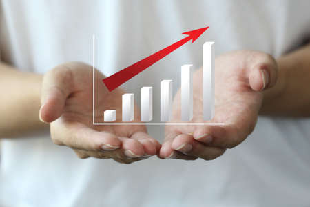 profit chart on hand, personal investment, backgroundの写真素材