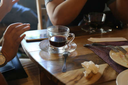 retro color tone, people with black coffee cupの写真素材