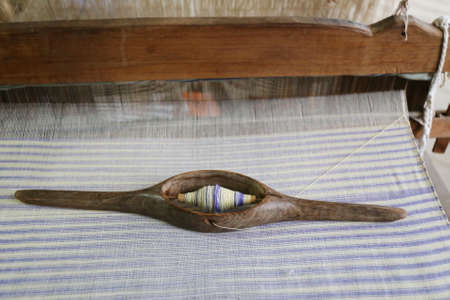 cotton weaving shuttle on the warpの写真素材