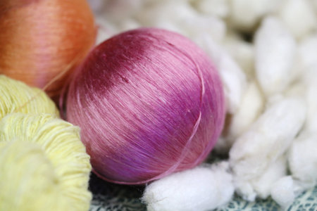 colorful raw silk thread in basketの写真素材
