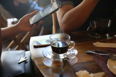 retro color tone, people with black coffee cupの写真素材