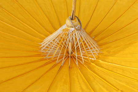 yellow paper and bamboo umbrella backgroundの写真素材