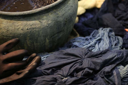 Dyeing Pots with colorful yarns dyed to blue fabric in Chiang Mai, Thailandの写真素材