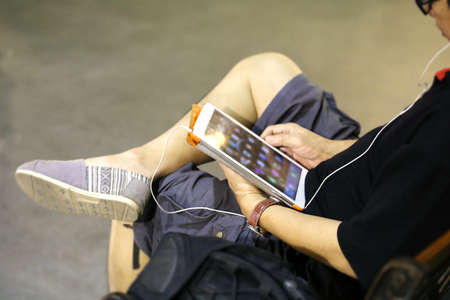 Man using tablet for relaxの写真素材