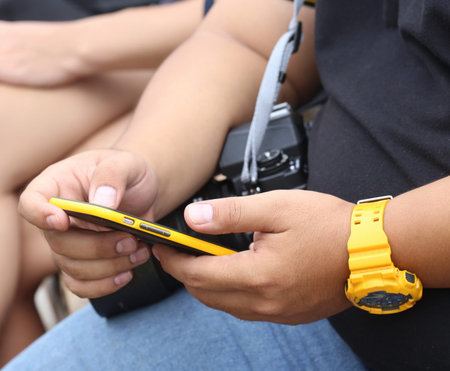 young man hand hold smartphone