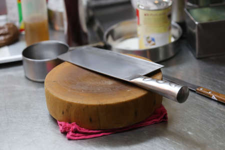 knife on woodboard in the restaurantの写真素材