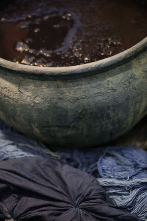 Dyeing Pots with colorful yarns dyed to blue fabric in Chiang Mai, Thailandの写真素材