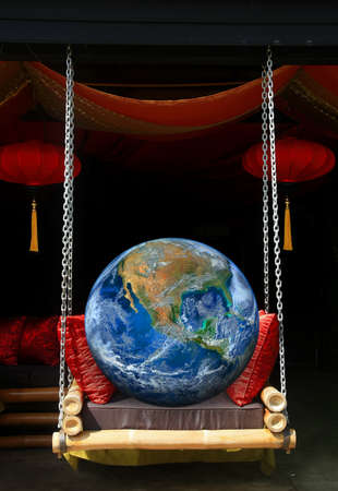 the earth on swingの写真素材