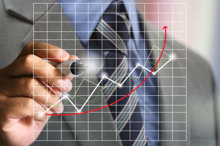 business man's hand writing graph chartの写真素材