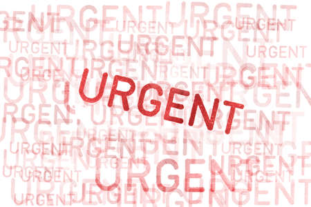 urgent rubber stamp on paper backgroundの写真素材