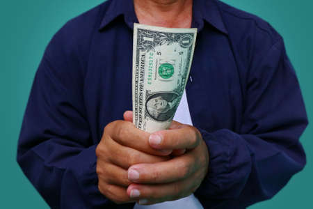 Businessman giving money, united states dollar (USD) bills - cashの写真素材