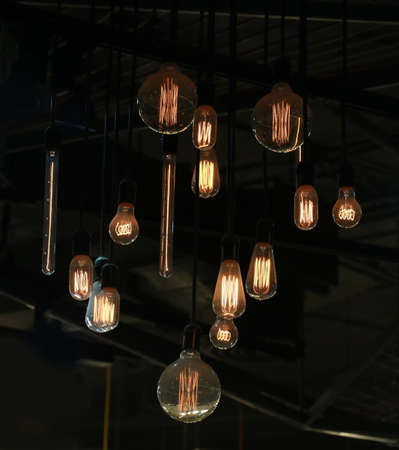Tungsten lamps hanging from ceilingの写真素材
