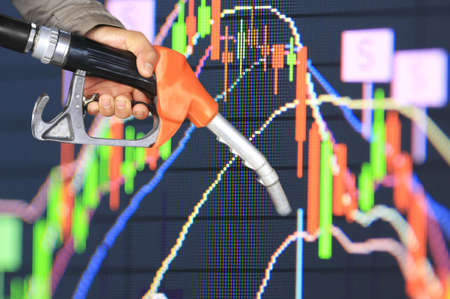 oil pump nozzle and stock chart backgroundの写真素材