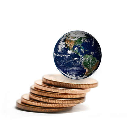 the earth on coins stacked ,including elements furnished by NASAの写真素材